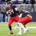 Archbishop Murphys Logan Fryberg celebrates a sack while Archbishop Murphys William Wilson picks up the loose ball during the 2A state championship game against Tumwater at Husky Stadium on Saturday, Dec. 6, 2025 in Seattle, Washington. (Olivia Vanni / The Herald)