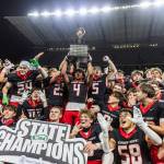 Archbishop Murphy holds up the 2A state championship trophy after beating Tumwater at Husky Stadium on Saturday, Dec. 6, 2025 in Seattle, Washington. (Olivia Vanni / The Herald)
