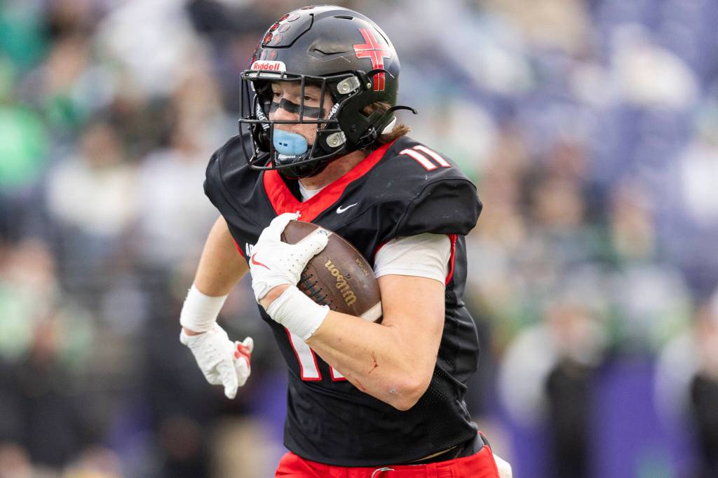 Archbishop Murphys Henry Gabalis runs the ball upfield during the 2A state championship game against Tumwater at Husky Stadium on Saturday, Dec. 6, 2025 in Seattle, Washington. (Olivia Vanni / The Herald)