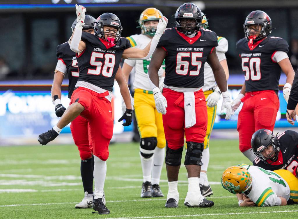 Archbishop Murphys Keagan Joseph reacts to getting a sack during the 2A state championship game against Tumwater at Husky Stadium on Saturday in Seattle. (Olivia Vanni / The Herald)
