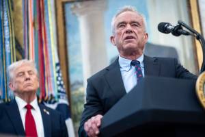 FILE — Health and Human Services Secretary Robert F. Kennedy Jr. speaks alongside President Donald Trump during an event announcing a drug pricing deal with Pfizer in the Oval Office of the White House in Washington, Sept. 30, 2025. Advisers to Kennedy appear poised to make consequential changes to the childhood vaccination schedule, delaying a shot that is routinely administered to newborns and discussing big changes to when or how other childhood immunizations are given. (Pete Marovich/The New York Times)