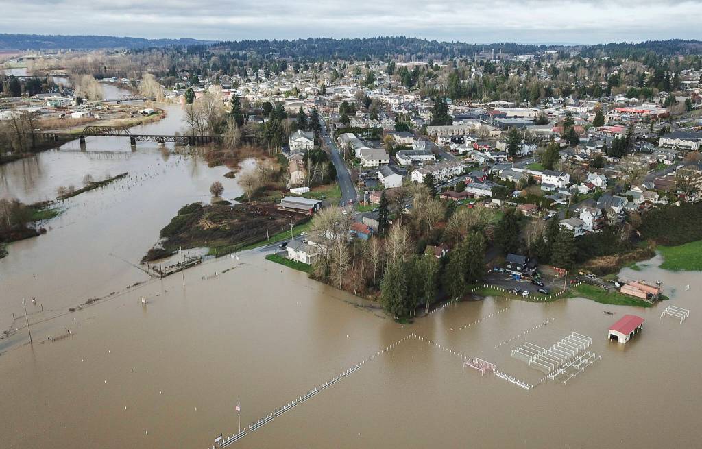 Water from the Snohomish River fills Stocker Fields and covers a portion of Old Snohomish Monroe Road on Tuesday, Dec. 9, 2025 in Snohomish, Washington. (Olivia Vanni / The Herald)