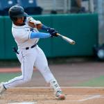 AquaSox catcher Harry Ford hits a fly ball during a game against the Vancouver Canadians on Thursday, June 8, 2023, at Funko Field in Everett, Washington. (Ryan Berry / The Herald)