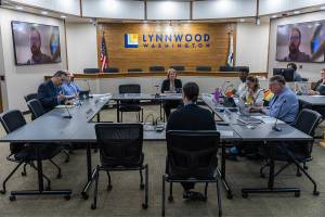 The Lynnwood City Council listens to a presentation by Finance Director Michelle Meyer during a city council meeting on on Monday, Sept. 15, 2025 in Lynnwood, Washington. (Olivia Vanni / The Herald)