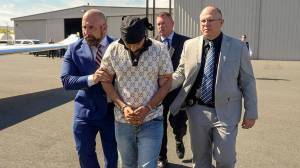 Florida Lt. Gov. Jay Collins, left, participates in the extradition from California of Harjinder Singh, accused of causing a crash that killed three people in Florida. (Photo via Collins X account)