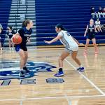Glacier Peak freshman Aliyah Jazmin (right) positions herself in front of Shorewood junior Karmin Kasberg during the Grizzlies 77-46 win against the Stormrays at Glacier Peak High School on Dec. 9, 2025. (Joe Pohoryles / The Herald)
