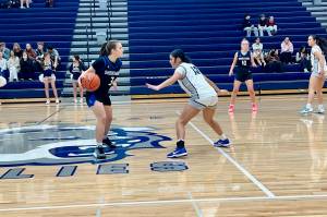 Glacier Peak freshman Aliyah Jazmin (right) positions herself in front of Shorewood junior Karmin Kasberg during the Grizzlies' 77-46 win against the Stormrays at Glacier Peak High School on Dec. 9, 2025. (Joe Pohoryles / The Herald)
