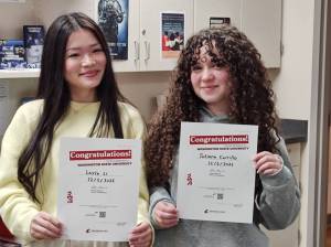 Layla Li (left) and Tatiana Carrillo Parra celebrate their admission to Washington State University on Dec. 5 at Arlington High School during an On-the-Spot Admissions event. (Provided photo)