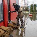 Bob Hammond, an employee at Red Pepper Pizzeria & Pasta, locks up after checking on the extent of flood damage inside on Thursday, Dec. 11, 2025 in Sultan, Washington. (Olivia Vanni / The Herald)