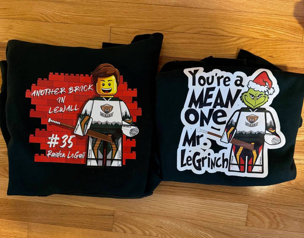 The Another Brick in LeWall and LeGrinch merchandise, designed by Justin Morison, laid out side by side. (Photo courtesy Tim Morison)