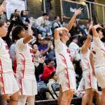 The Tulalip Heritage bench reacts to a 3-point shot during the winner-to-state playoff game against Muckleshoot Tribal School on Tuesday, Feb. 18, 2025 in Marysville, Washington. (Olivia Vanni / The Herald)