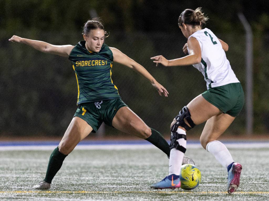 Shorecrests Olivia Taylor keeps the ball away from Edmonds-Woodways Magdalena Waters during the game on Sept. 23, 2025 in Shoreline. (Olivia Vanni / The Herald)