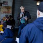 Rick Steves speaks to community members gathered at the Jean Kim Foundation Hygiene Center after announcing he purchased the current property so the center will not have to close on Wednesday, Dec. 17, 2025 in Lynnwood, Washington. (Olivia Vanni / The Herald)