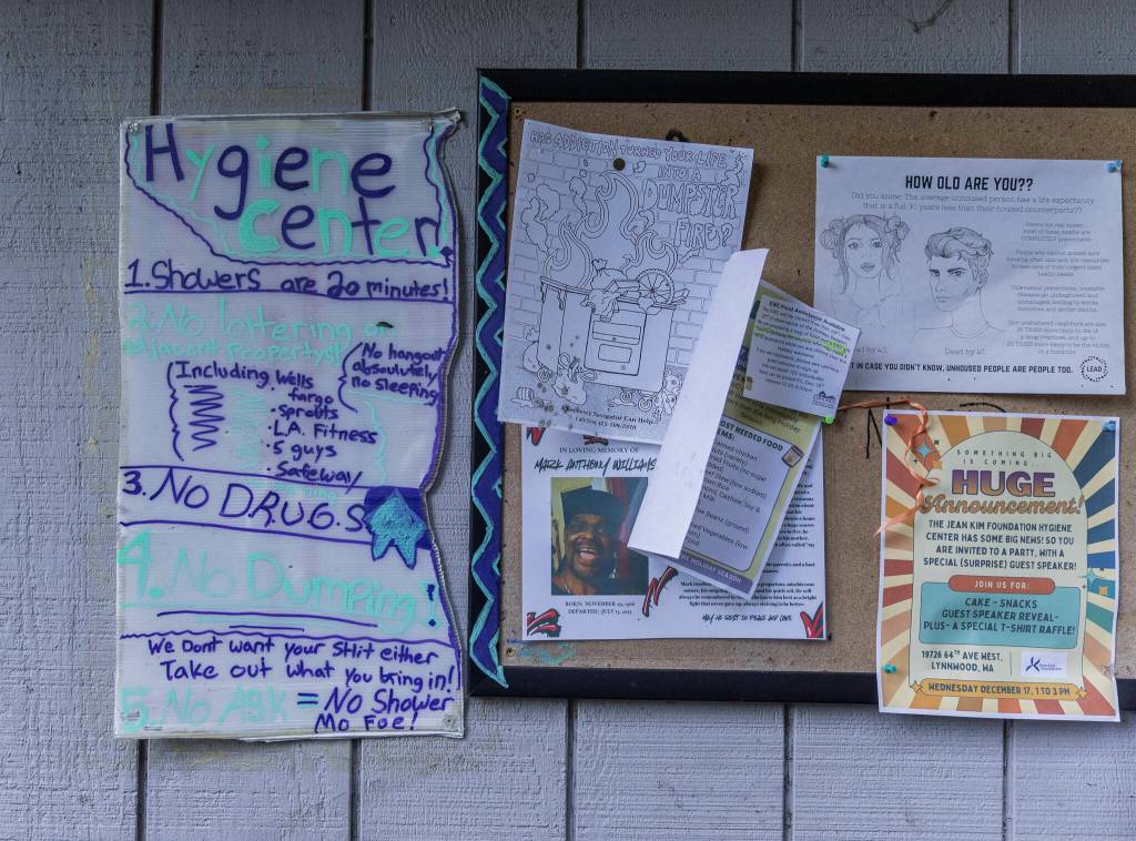A community board displays flyers next to a hygiene center rule board on Wednesday, Dec. 17, 2025 in Lynnwood, Washington. (Olivia Vanni / The Herald)