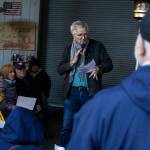 Rick Steves speaks to community members gathered at the 
Jean Kim Foundation Hygiene Center after announcing he purchased the current property so the center will not have to close on Wednesday, Dec. 17, 2025 in Lynnwood, Washington. (Olivia Vanni / The Herald)