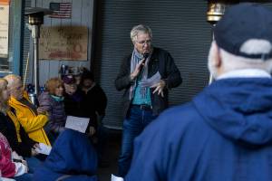 Rick Steves speaks to community members gathered at the 
Jean Kim Foundation Hygiene Center after announcing he purchased the current property so the center will not have to close on Wednesday, Dec. 17, 2025 in Lynnwood, Washington. (Olivia Vanni / The Herald)
