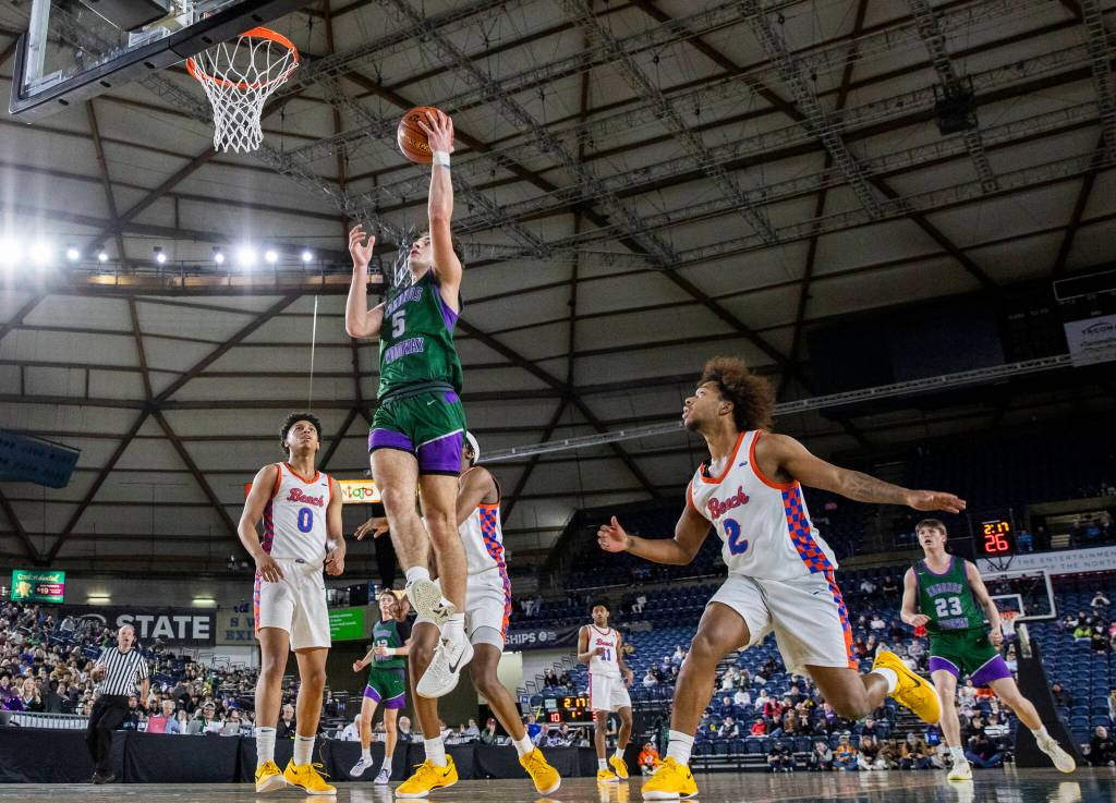 Edmonds-Woodways Cam Hiatt makes a layup during the 3A boys championship game against Rainier Beach on Saturday, March 8, 2025 in Tacoma, Washington. (Olivia Vanni / The Herald)