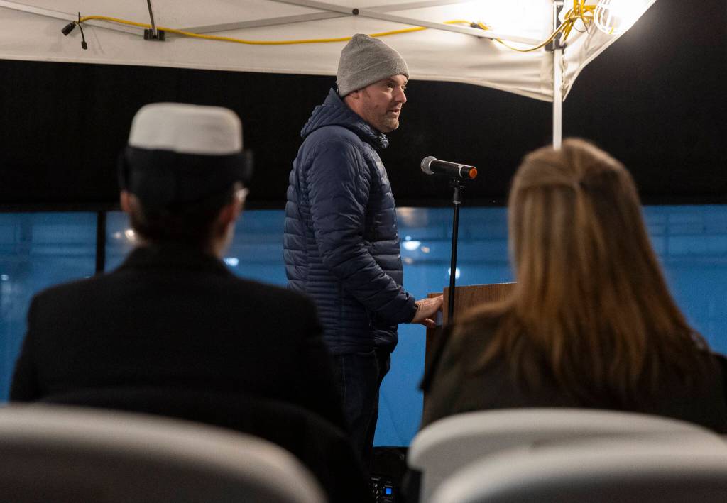 Travis Gannon, founder of One Day at a Time, speaks at Snohomish Countys Veterans Homelessness Committees annual Homeless Memorial Vigil on Friday, Dec. 19, 2025 in Everett, Washington. (Olivia Vanni / The Herald)