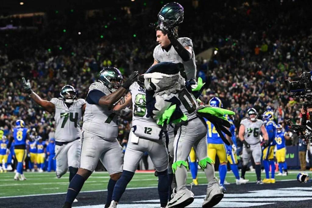 Seattle Seahawks tight end Eric Saubert is lifted up by his teammates after scoring the game-winning 2-point conversion against the Los Angeles Rams on Thursday at Lumen Field in Seattle. (Photo courtesy of the Seattle Seahawks)