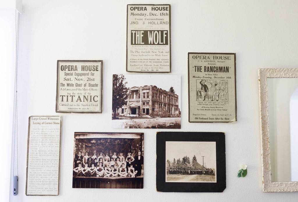 Scans of historical Marysville Opera House flyers hang on a wall on Sept. 16, 2025 in Marysville, Washington. (Olivia Vanni / The Herald)
