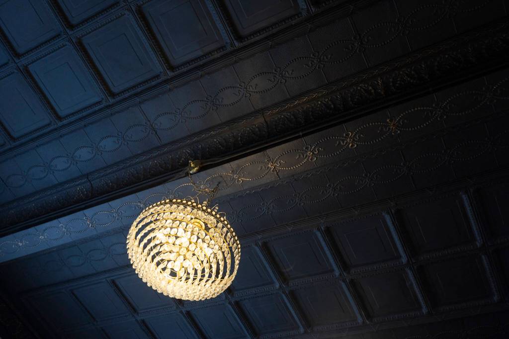 A chandelier hangs form the ceiling of the Marysville Opera House on Sept. 16, 2025 in Marysville, Washington. (Olivia Vanni / The Herald)