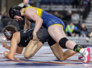Everett’s Mia Cienga gets control of her opponent's foot during the 190-pound 3A girls championship match at the Mat Classic on Friday, Feb. 21, 2025 in Tacoma, Washington. (Olivia Vanni / The Herald)