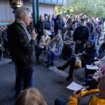 People listen as Rick Steves announces his purchase of a facility for continued use by the Jean Kim Foundations Lynnwood Hygiene Center, Dec. 17, in Lynnwood. (Olivia Vanni / The Herald file photo)