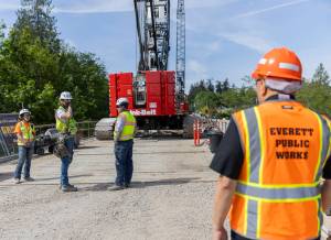 Edgewater Bridge construction workers talk as demolition continues on the bridge on Friday, May 9, 2025 in Everett, Washington. (Olivia Vanni / The Herald)