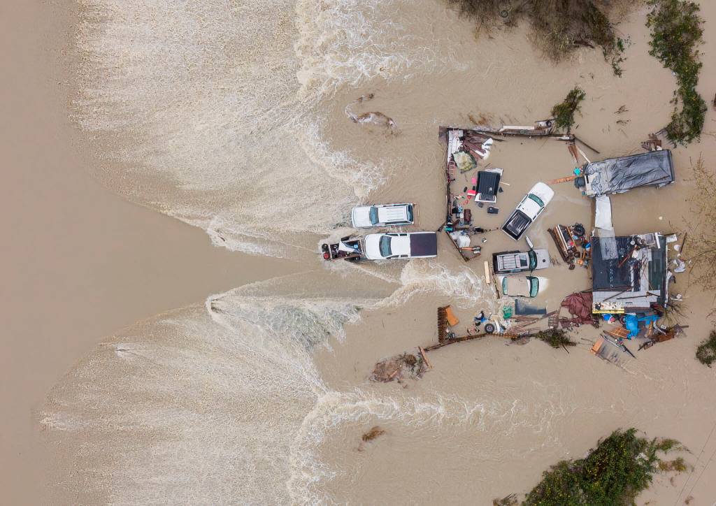 Water from the Snohomish River surrounds a residence along the west side of Lowell Snohomish River Road on Thursday, Dec. 11, 2025, in Snohomish, Washington. (Olivia Vanni / The Herald)
