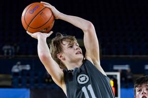 Glacier Peaks Reed Nagel runs into Gonzaga Preps Hudson Floyd while trying to make a jump shot during the 4A boys semifinal game on Friday, March 7, 2025 in Tacoma, Washington. (Olivia Vanni / The Herald)