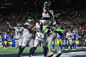 Seattle Seahawks tight end Eric Saubert is lifted up by his teammates after scoring the game-winning 2-point conversion against the Los Angeles Rams on Thursday, Dec. 18, 2025 at Lumen Field in Seattle, Washington. (Photo courtesy of the Seattle Seahawks)