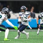Seahawks safety Julian Love runs with the ball after intercepting a Carolina Panthers pass at Bank of America Stadium in Charlotte, North Carolina on Sunday, Dec. 28, 2025. (Photo courtesy of the Seattle Seahawks)