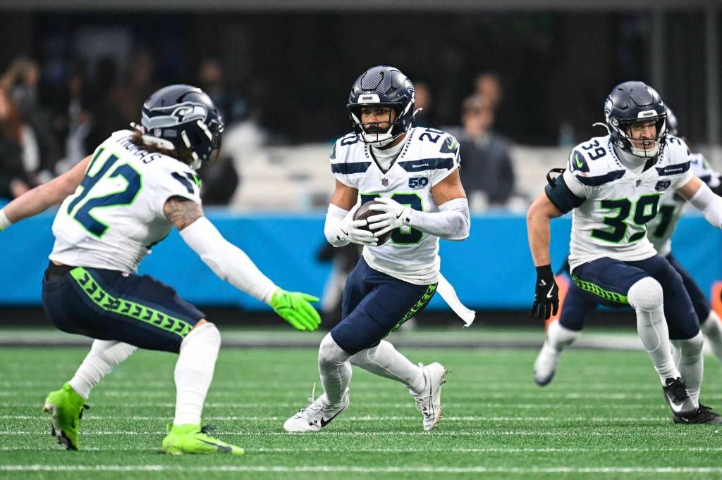 Seahawks safety Julian Love runs with the ball after intercepting a Carolina Panthers pass at Bank of America Stadium in Charlotte, North Carolina on Sunday. (Photo courtesy of the Seattle Seahawks)