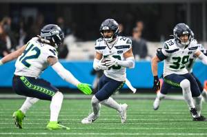 Seahawks safety Julian Love (20) runs with the ball after intercepting a Carolina Panthers pass at Bank of America Stadium in Charlotte, North Carolina on Sunday, Dec. 28, 2025. (Photo courtesy of the Seattle Seahawks)