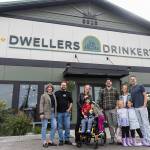 Dwellers Drinkery co-owners and family outside of their business on Sept. 25, 2025 in Lake Stevens, Washington. (Olivia Vanni / The Herald)