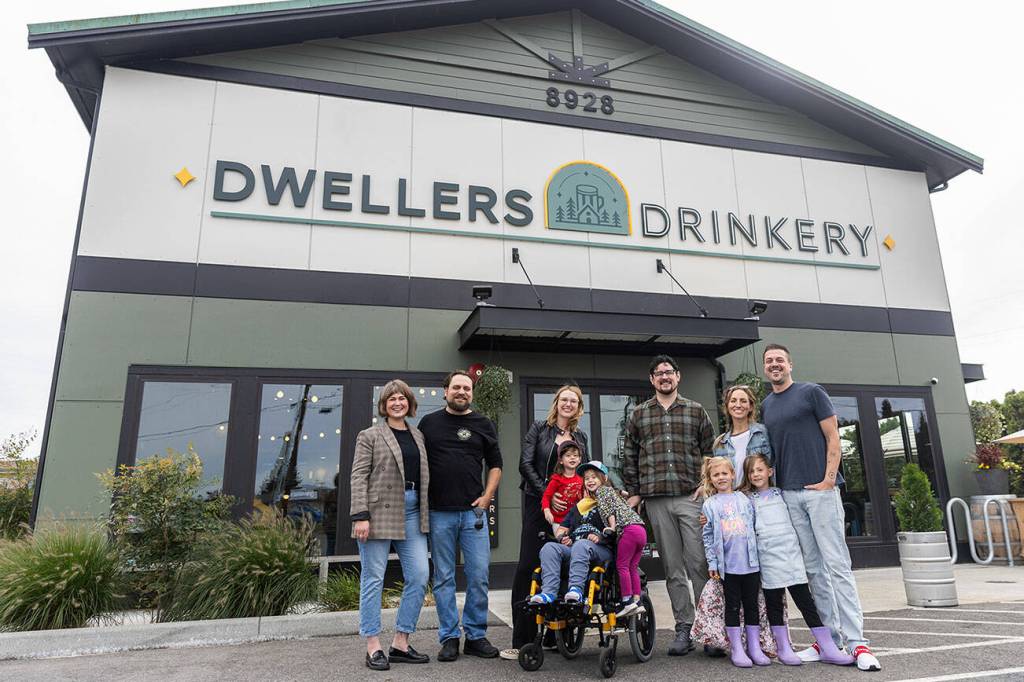 Dwellers Drinkery co-owners and family outside of their business on Sept. 25, 2025 in Lake Stevens, Washington. (Olivia Vanni / The Herald)