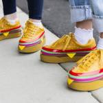 People wear burger-themed shoes for the grand opening to the Everett location of Dick’s Drive-In on Thursday, June 12, 2025 in Everett, Washington. (Olivia Vanni / The Herald)