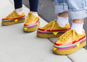 People wear burger-themed shoes for the grand opening to the Everett location of Dick’s Drive-In on Thursday, June 12, 2025 in Everett, Washington. (Olivia Vanni / The Herald)