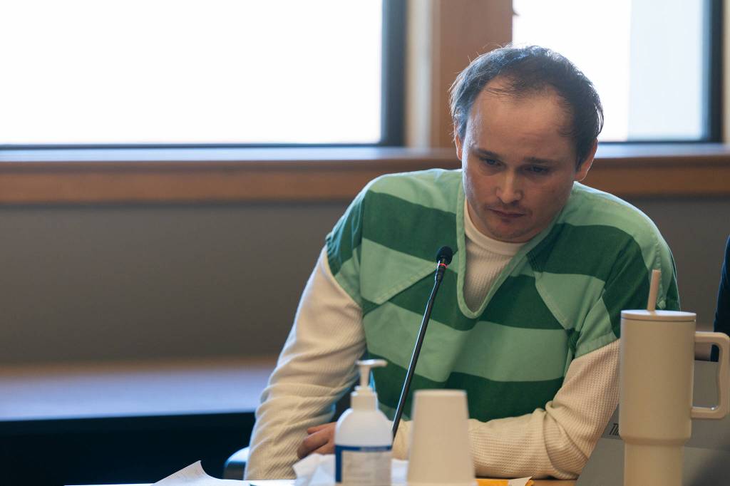 Christian Sayre reads a statement during a sentencing hearing Monday, July 21 at the Snohomish County Courthouse in Everett, Washington. (Will Geschke / The Herald)