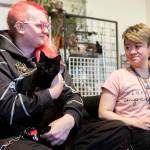 Nolla Rohr holds October while seated on the couch on Tuesday, Jan. 20, 2026 in Lynnwood, Washington. (Olivia Vanni / The Herald)