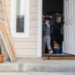 Raiden, 4, puts his jacket on and walks out the front door on Tuesday, Dec. 30, 2025 in Marysville, Washington. (Olivia Vanni / The Herald)