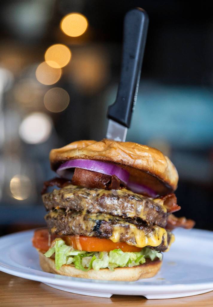 A double cheeseburger with bacon available at the Flying Pig on Monday, Dec. 29, 2025 in Everett, Washington. (Olivia Vanni / The Herald)
