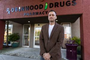 Robinhood Drugs Pharmacy owner Dr. Sovit Bista outside of his store on Tuesday, Dec. 30, 2025 in Everett, Washington. (Olivia Vanni / The Herald)