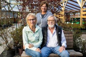 Liesa Postema, center, with her parents John and Marijke Postema, owners of Flower World on Wednesday, Dec. 31, 2025 in Snohomish, Washington. (Olivia Vanni / The Herald)