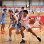 Everett freshman Noah Parker drives past Spokane sophomore Eloy Chaparro during the Trojans 93-92 overtime loss to the Sasquatch at Walt Price Student Fitness Center on Jan. 3, 2026. (Daniel Acosta / Everett CC)