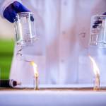 A standard jet fuel, left, burns with extensive smoke output while a sustainable avation fuel, right, produces less smoke during a demonstration of the difference in fuel emissions on Tuesday, March 28, 2023 in Everett, Washington. (Olivia Vanni / The Herald)