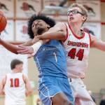 Meadowdales Noah Million tries to keep possession of the ball while Snohomishs Julian Buck defend during the game on Monday, Jan. 5, 2026 in Snohomish, Washington. (Olivia Vanni / The Herald)