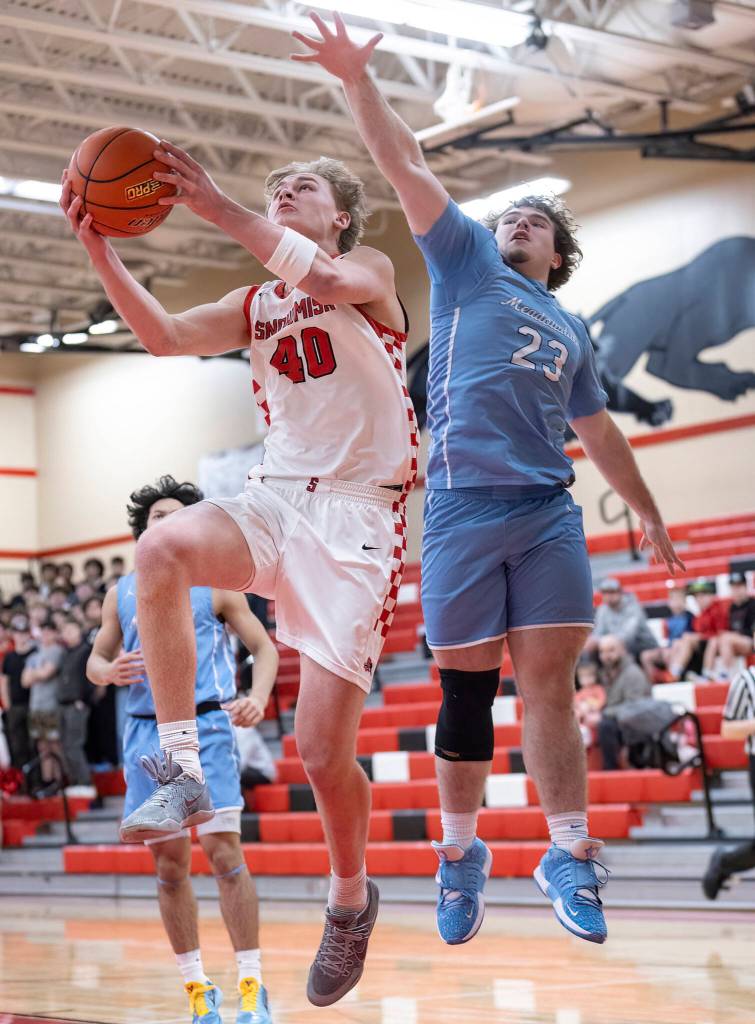 Snohomishs Hudson Smith makes a shot while Meadowdales Marley Miller defends during the game on Monday, Jan. 5, 2026 in Snohomish, Washington. (Olivia Vanni / The Herald)