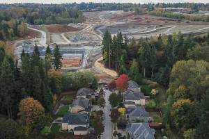 A view of the Eastview development looking south along 79th Avenue where mud and water runoff flowed due to rain on Oct. 16, 2025 in Snohomish, Washington. (Olivia Vanni / The Herald)