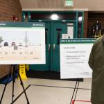 Attendees look at boards showing the proposed roadway design of the 88th Street improvements during a town hall on Tuesday in Marysville. (Will Geschke / The Herald)